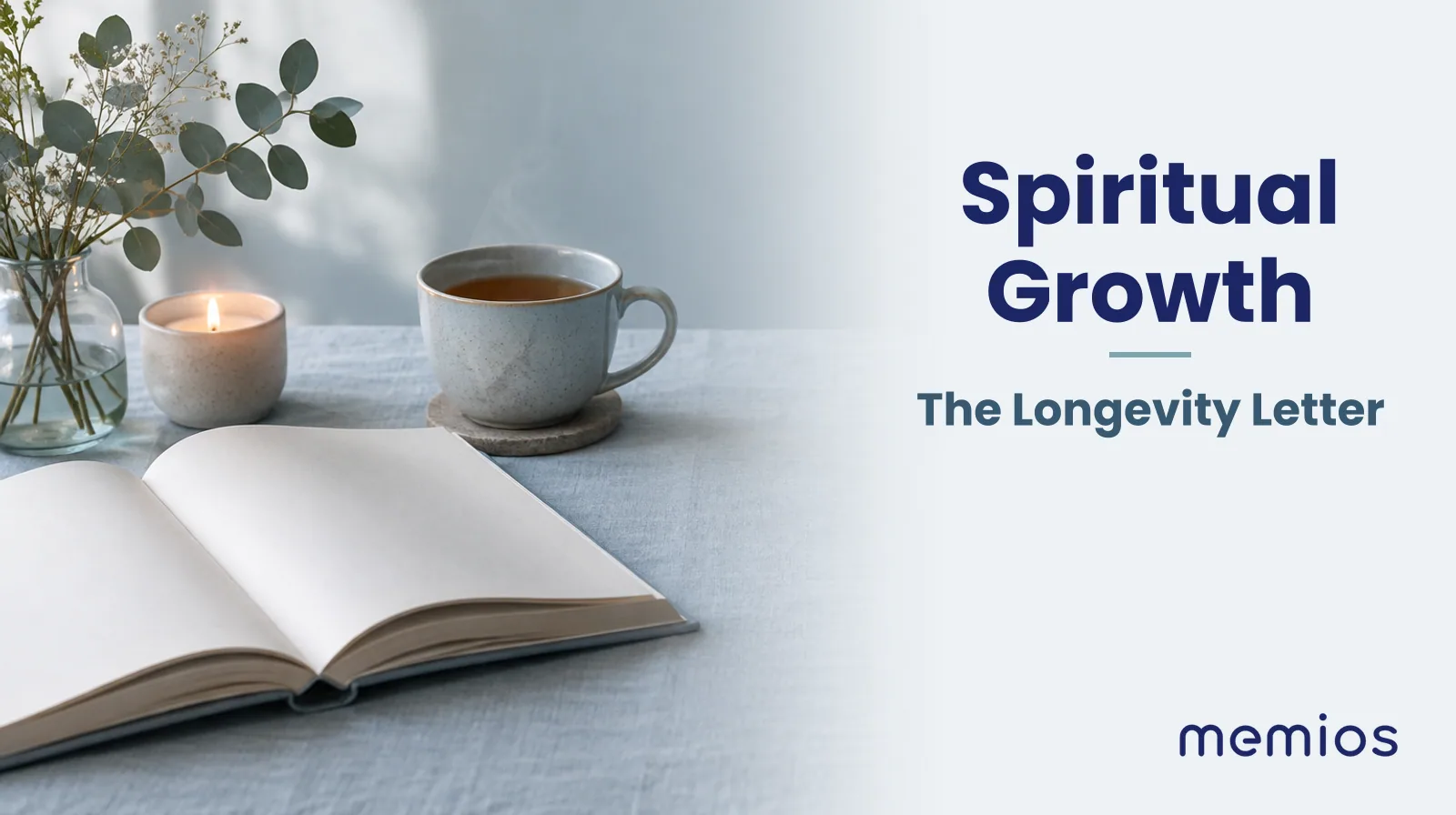 Photograph for Spiritual Growth: an open book with blank pages, a small candle and a cup of tea on the linen.